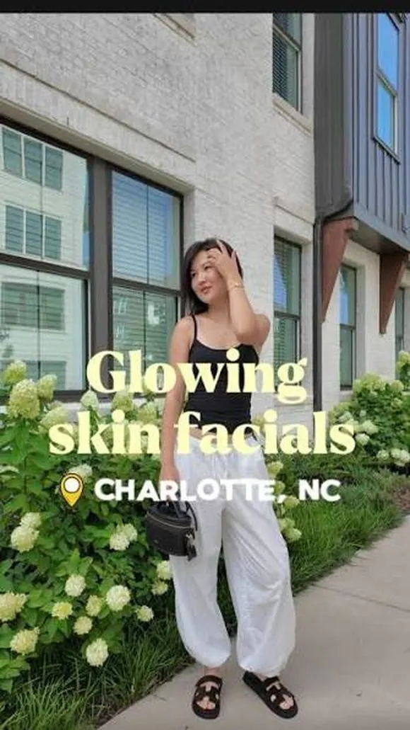 Creator posing by hydrangeas on a Charlotte sidewalk, captioned glowing skin facials